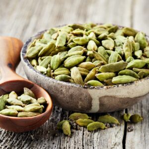 Cardamom on wooden background